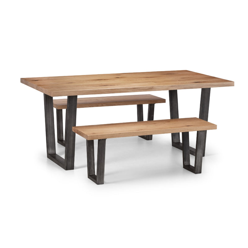 Wooden dining table with two matching benches on a white background