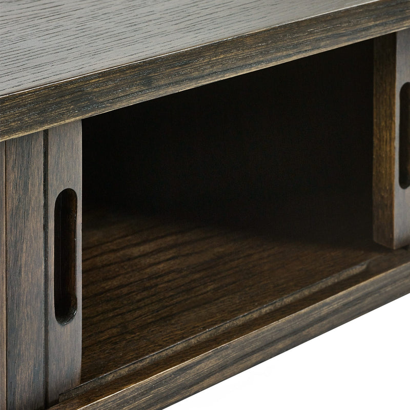 Close-up of a wooden TV stand with a dark brown finish.