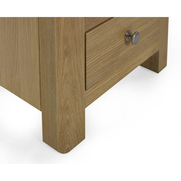 Wooden drawer with a metallic handle on a white background