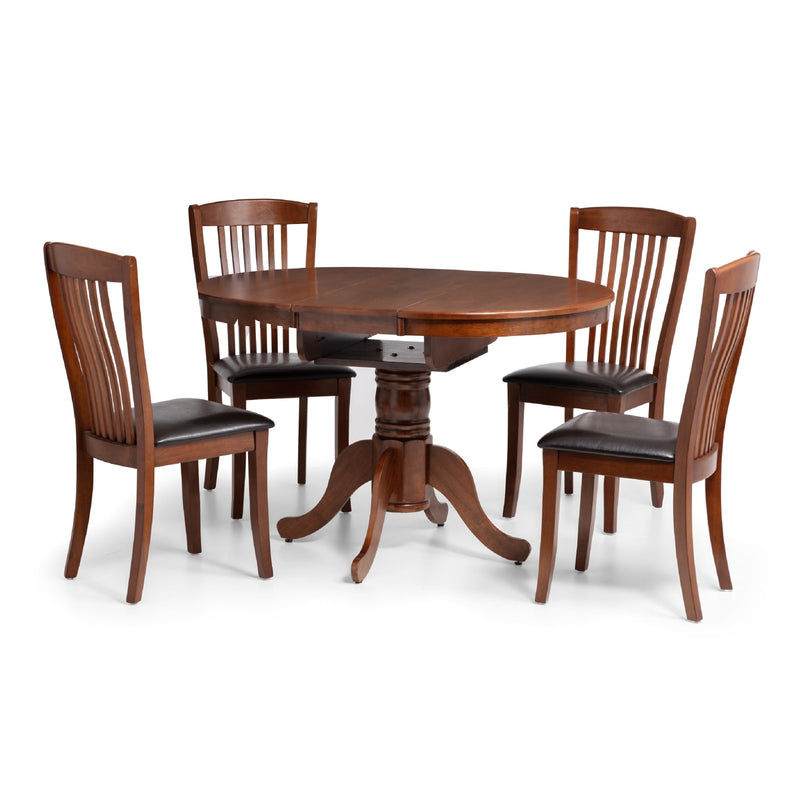 Wooden dining table with four matching chairs on a white background