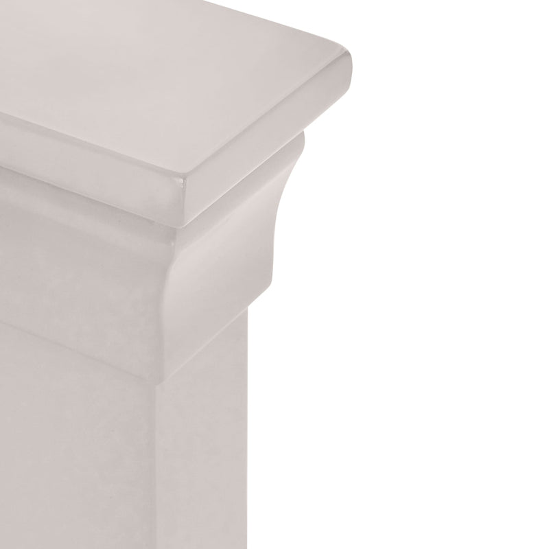 Close-up of a light gray upholstered chair corner on a white background
