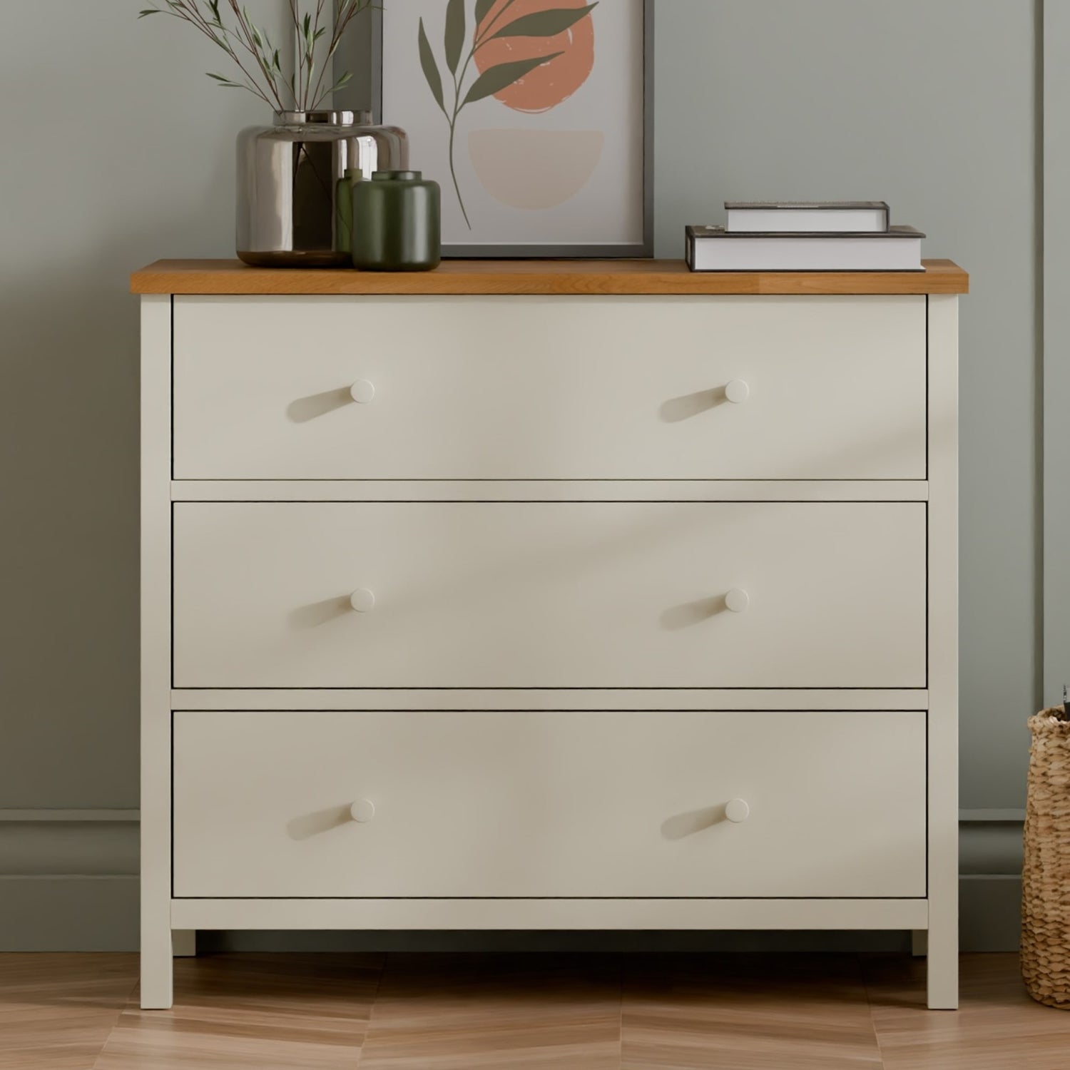 Beige dresser with wooden top against a neutral wall