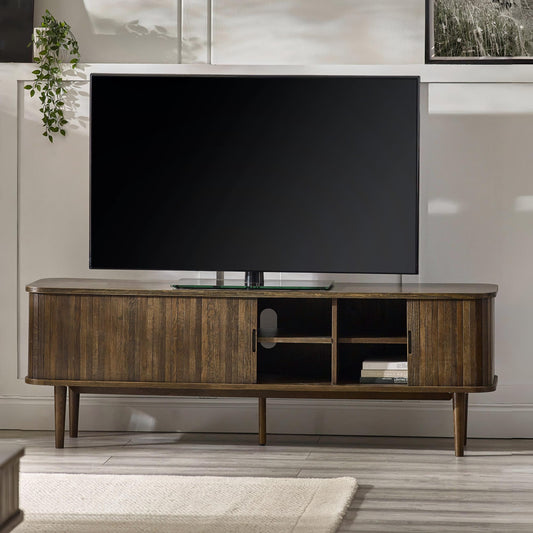 Wooden TV stand with a large flat-screen TV in a living room setting.