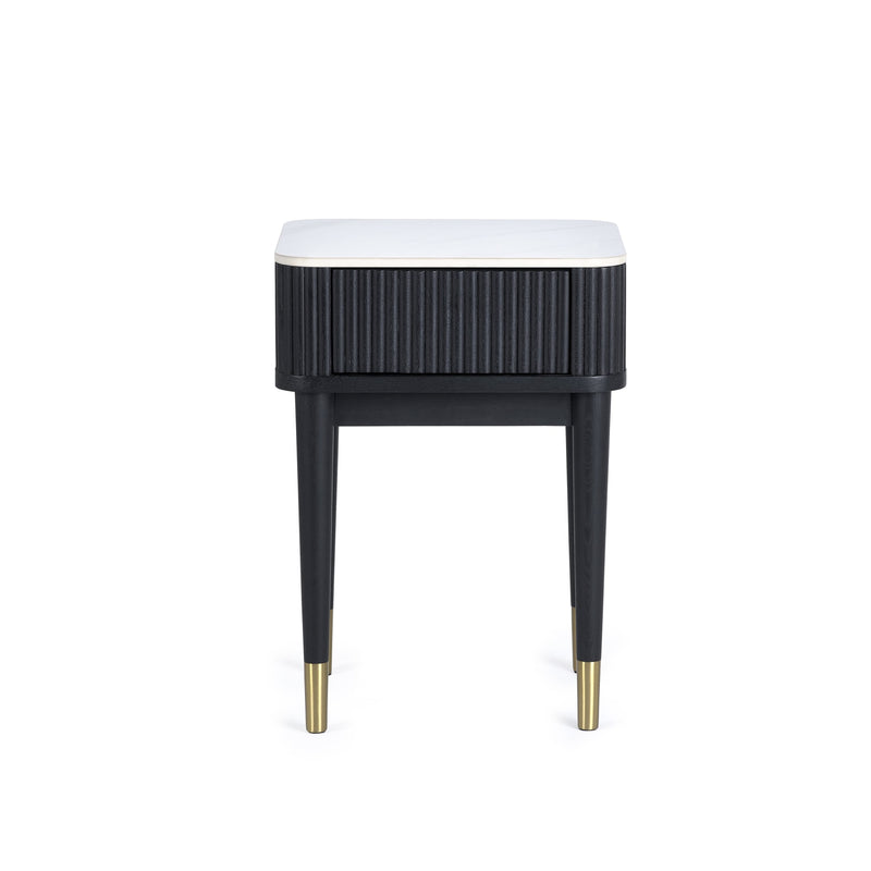 Black side table with white top on a white background