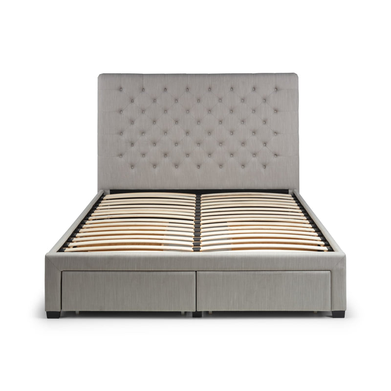 Gray upholstered bed with tufted headboard on a white background