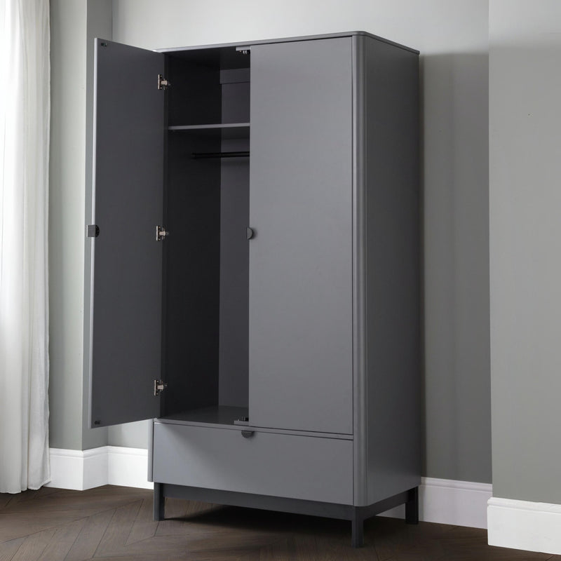 Gray wardrobe with open door in a room with gray walls and white baseboards.
