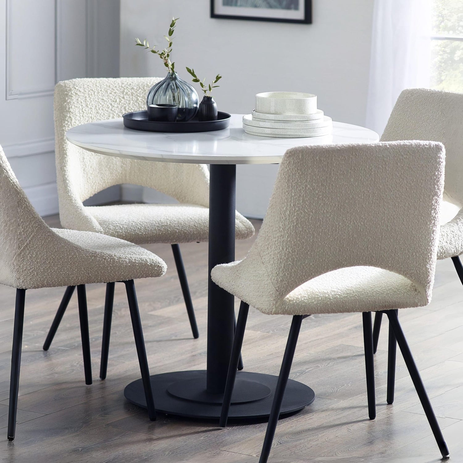 Dining table with chairs in a room setting
