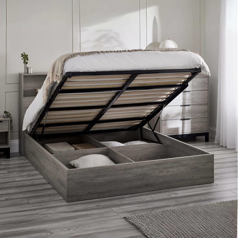 Wooden bed with storage compartments in a bedroom setting