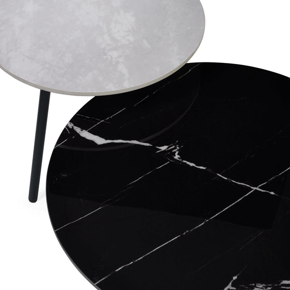 Black marble table with a white lampshade on a white background