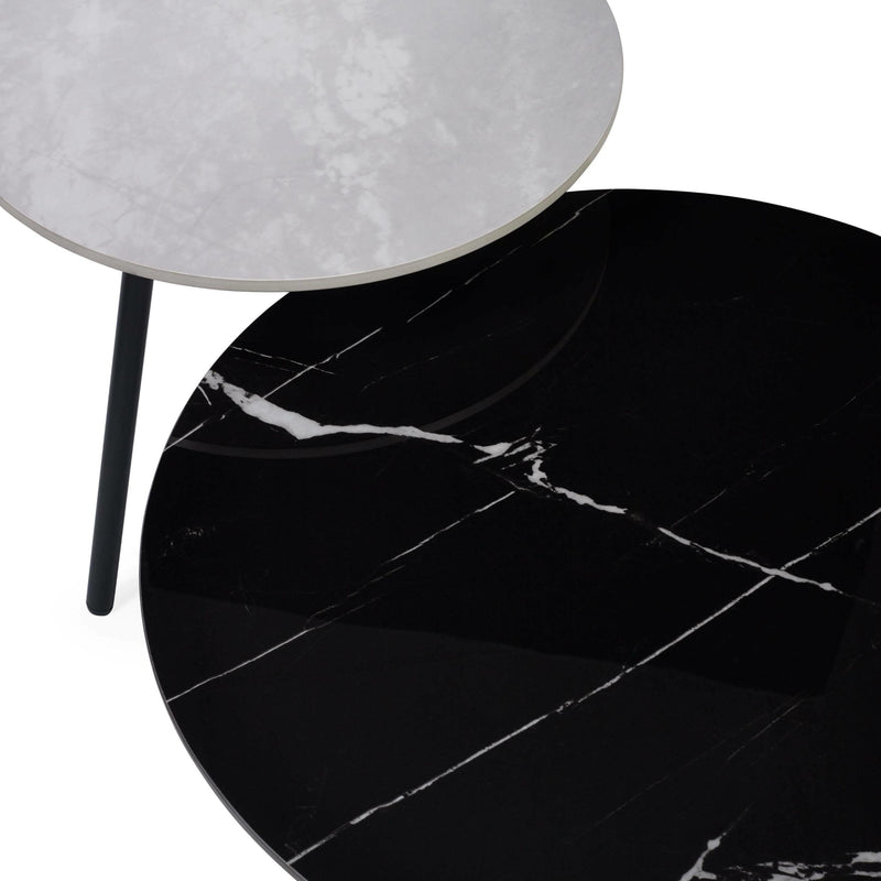 Black marble table with a white lampshade on a white background