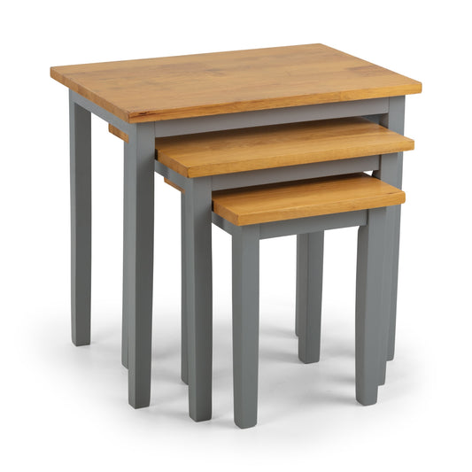 Set of three nesting tables with wooden tops and gray bases on a white background