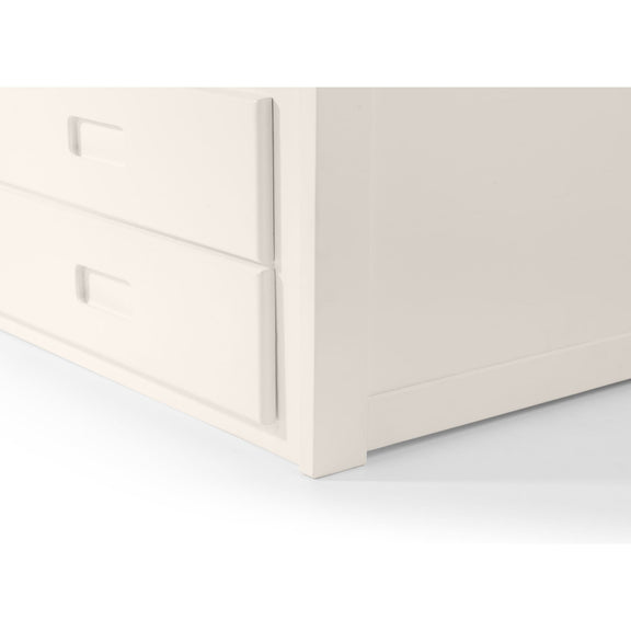 Close-up of a white drawer with metallic handles on a light gray background