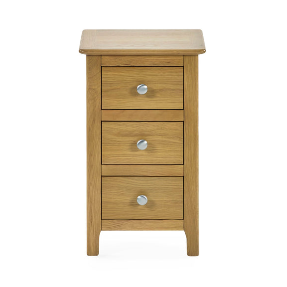 Wooden nightstand with three drawers and silver knobs on a white background