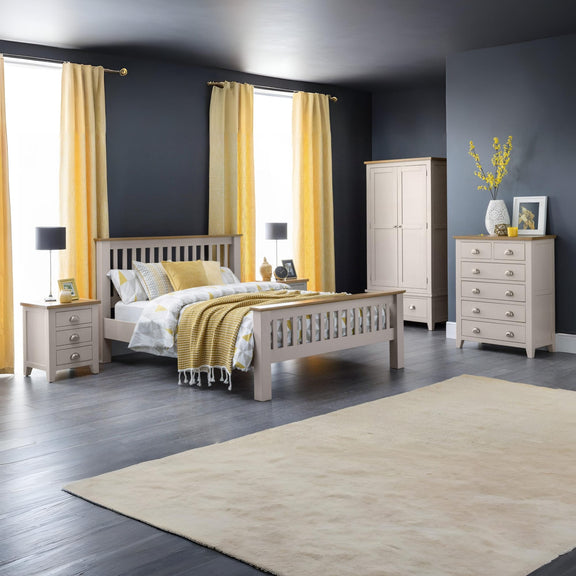 Bedroom with gray walls, yellow curtains, and wooden furniture.