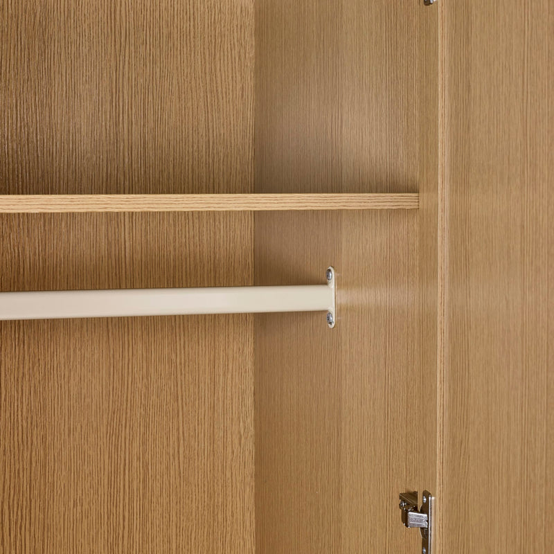 Wooden wardrobe with two shelves and a hanging rod on a wooden door.
