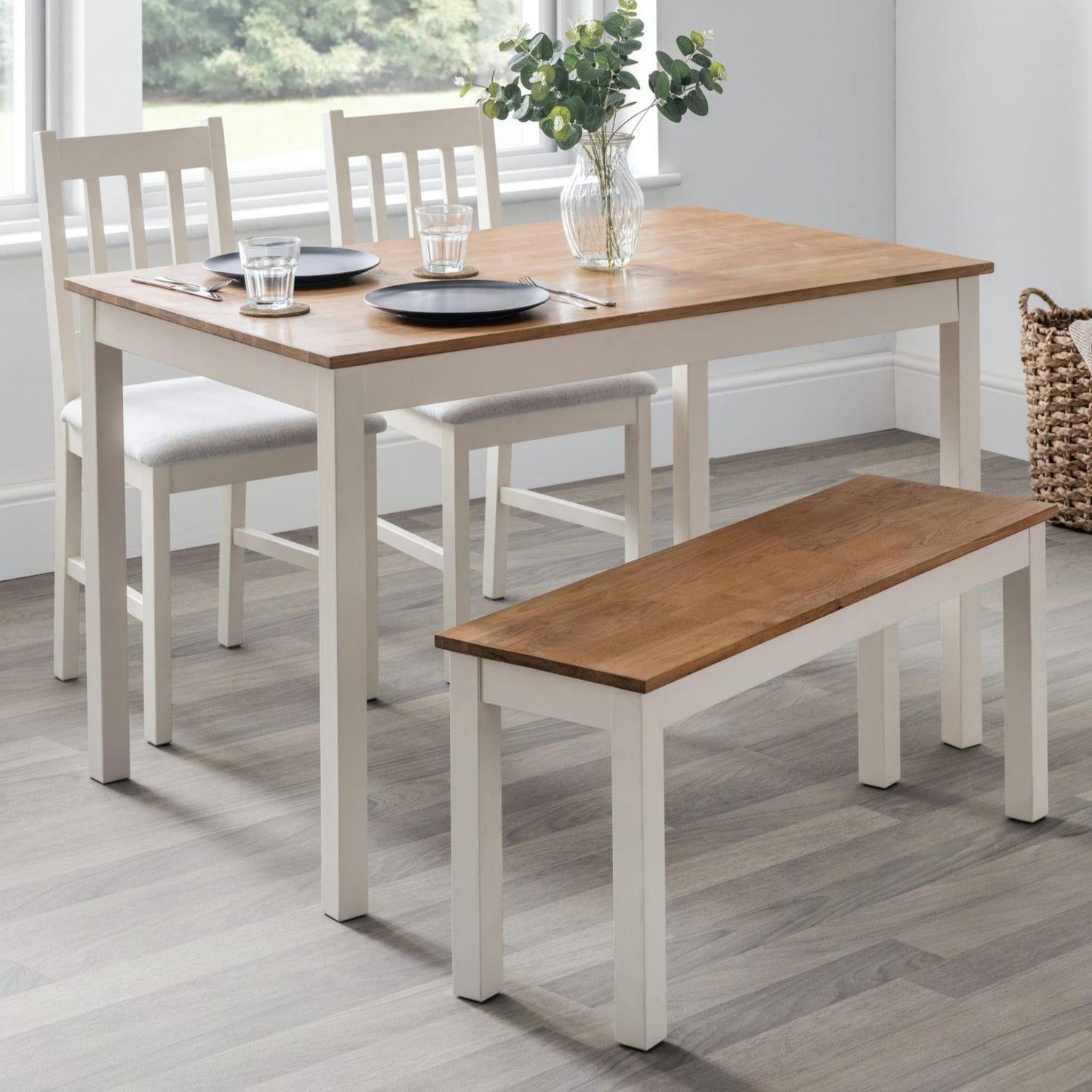 Dining set with table, chairs, and bench on a wooden floor.
