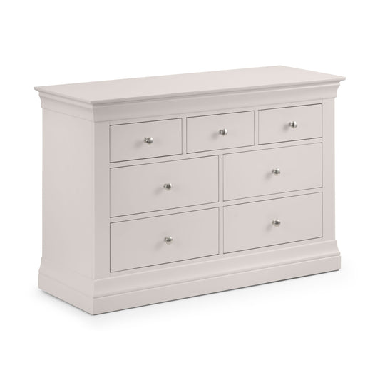 White dresser with multiple drawers on a white background