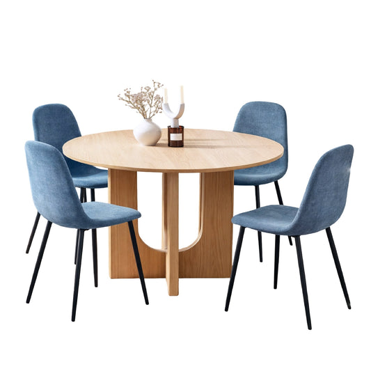 Round wooden dining table with four blue chairs on a white background