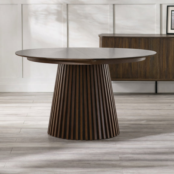 Wooden dining table with a modern design on a wooden floor.
