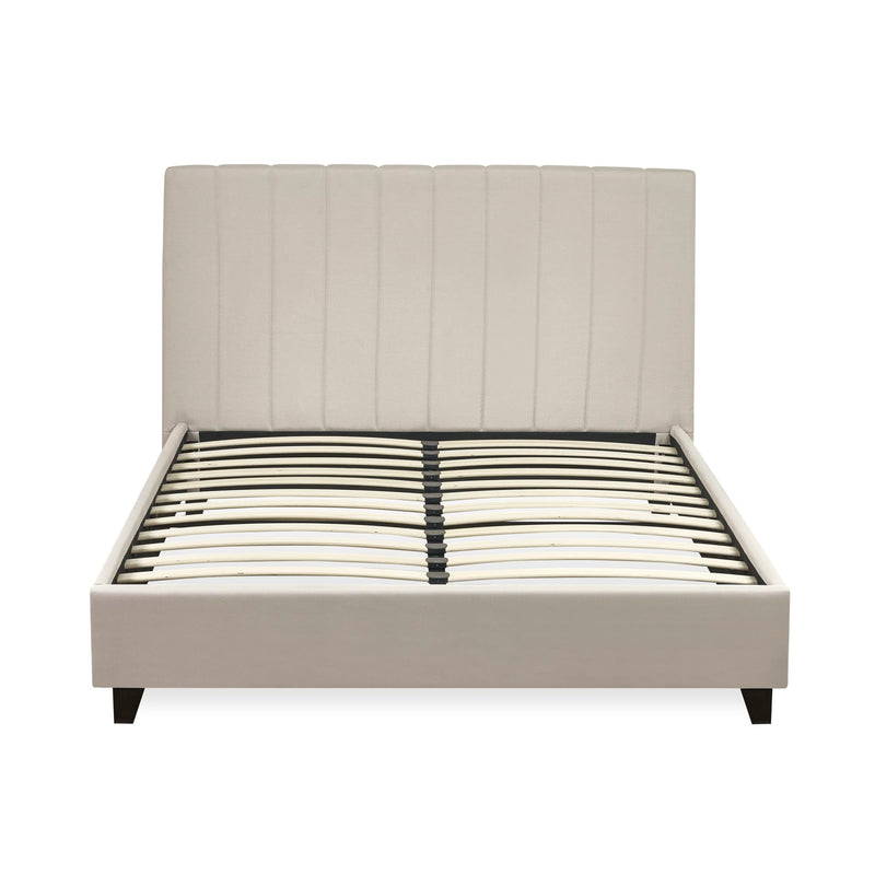 Beige upholstered bed frame with wooden slat support on a white background