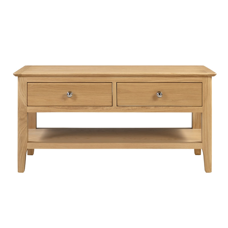 Wooden coffee table with two drawers on a white background
