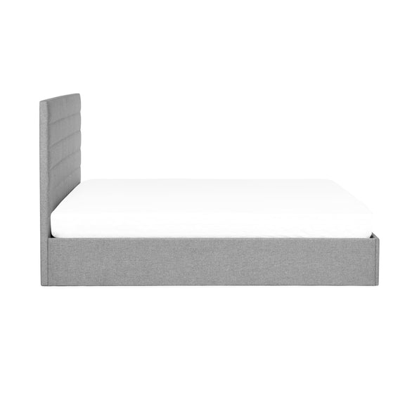 Gray upholstered bed frame corner on a white background