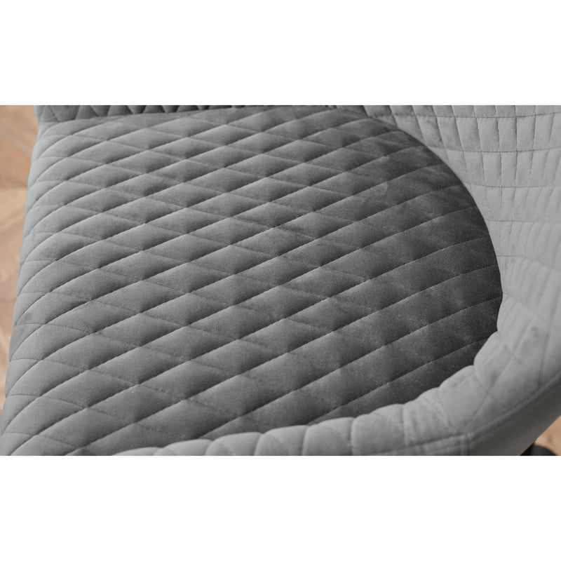 Gray quilted saddle pad on a wooden surface