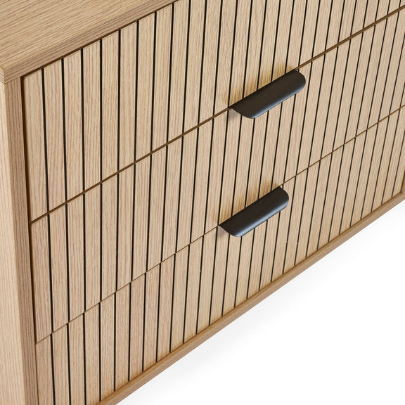 Wooden cabinet with vertical slats and black handles on a white background
