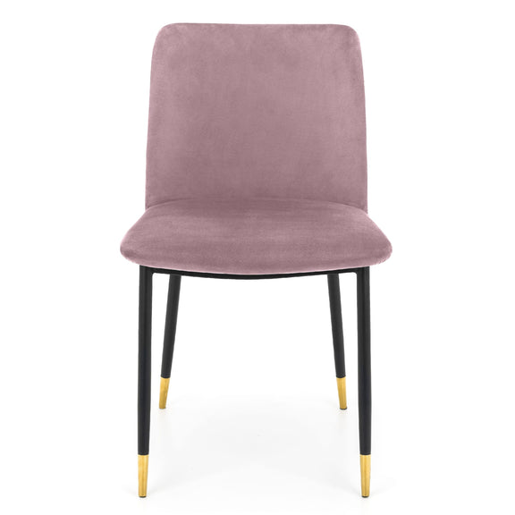Pink velvet chair with black legs and gold tips on a white background