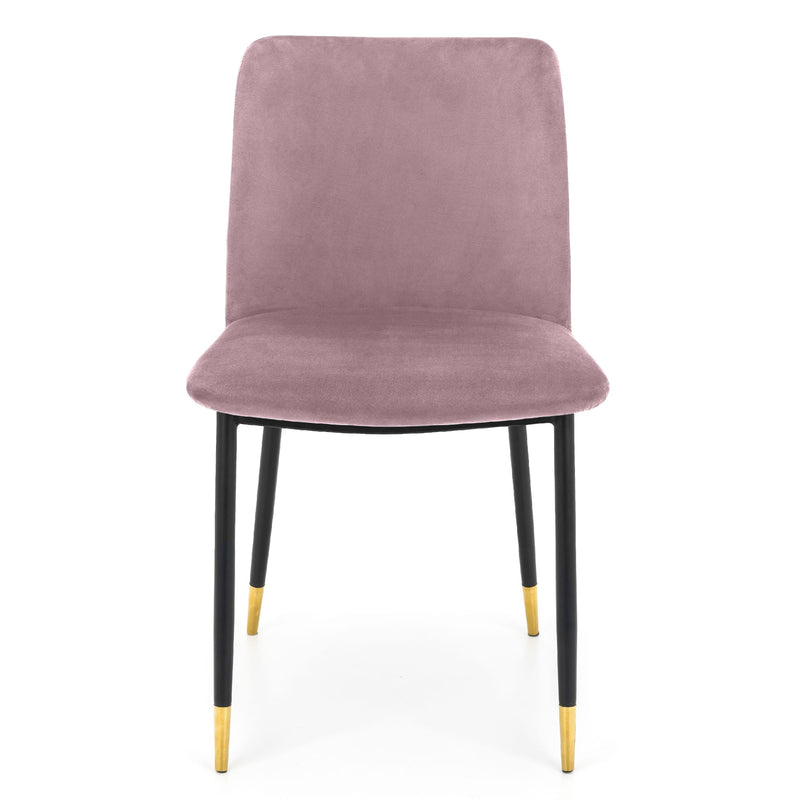 Pink velvet chair with black legs and gold tips on a white background