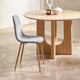 Wooden dining table with a gray chair on a wooden floor
