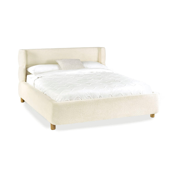 Beige upholstered bed with white mattress and pillows on a white background