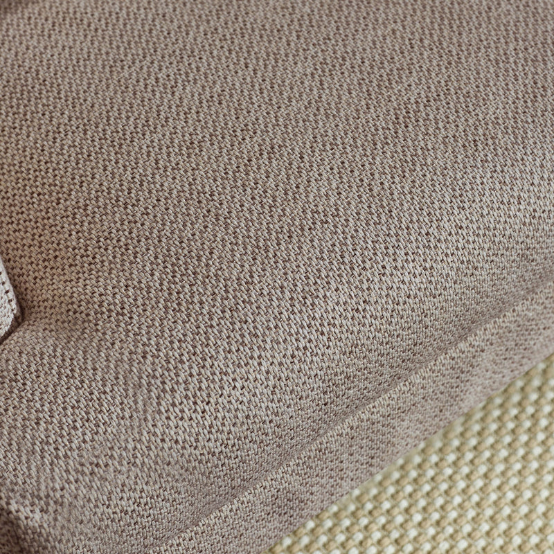 Close-up of textured brown fabric with a subtle pattern