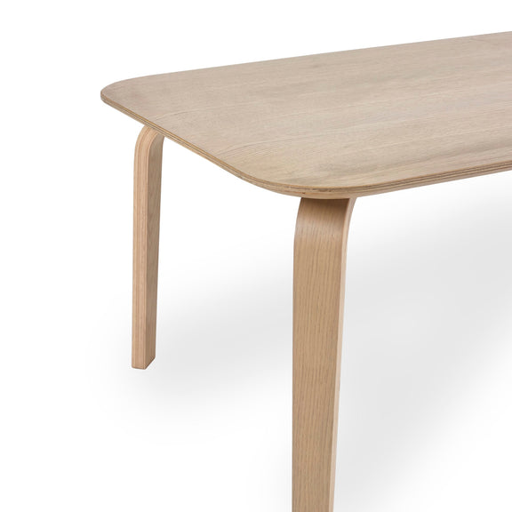 Wooden table with a light finish on a white background