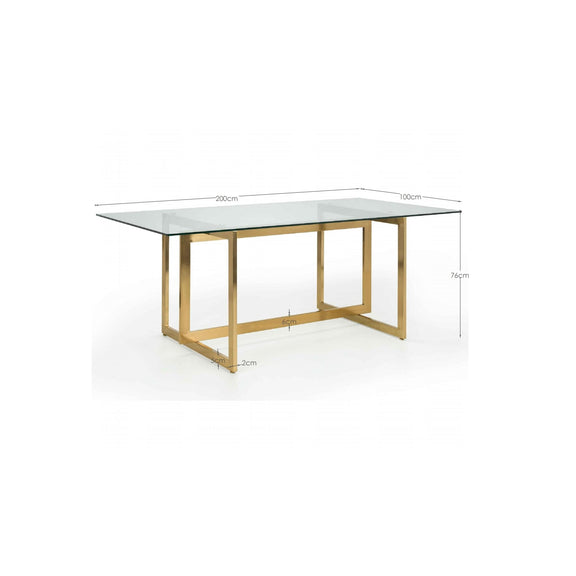 Dining table with glass top and gold metal frame, shown with dimensions on a white background.
