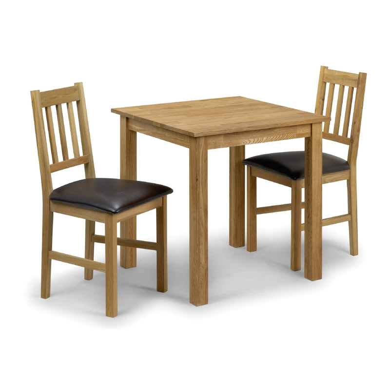 Wooden dining table with two chairs on a white background