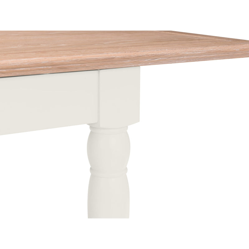 Wooden table with white legs on a white background