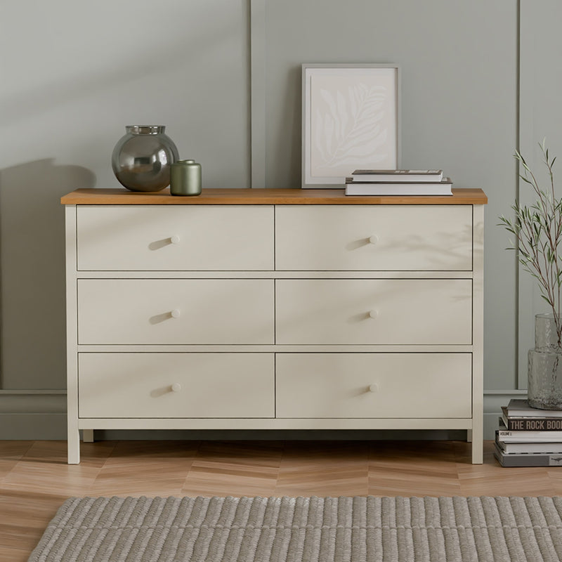 Beige dresser with wooden top in a room setting