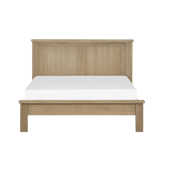 Wooden bed frame with a white mattress on a white background