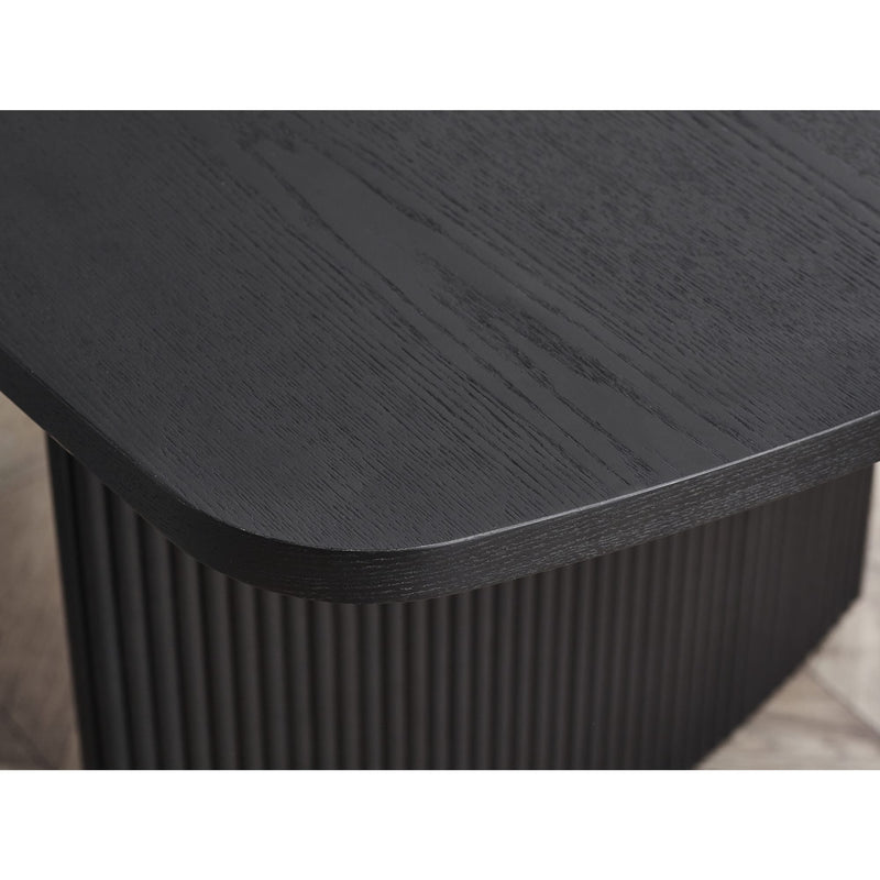Black rectangular table with a ribbed base on a neutral background