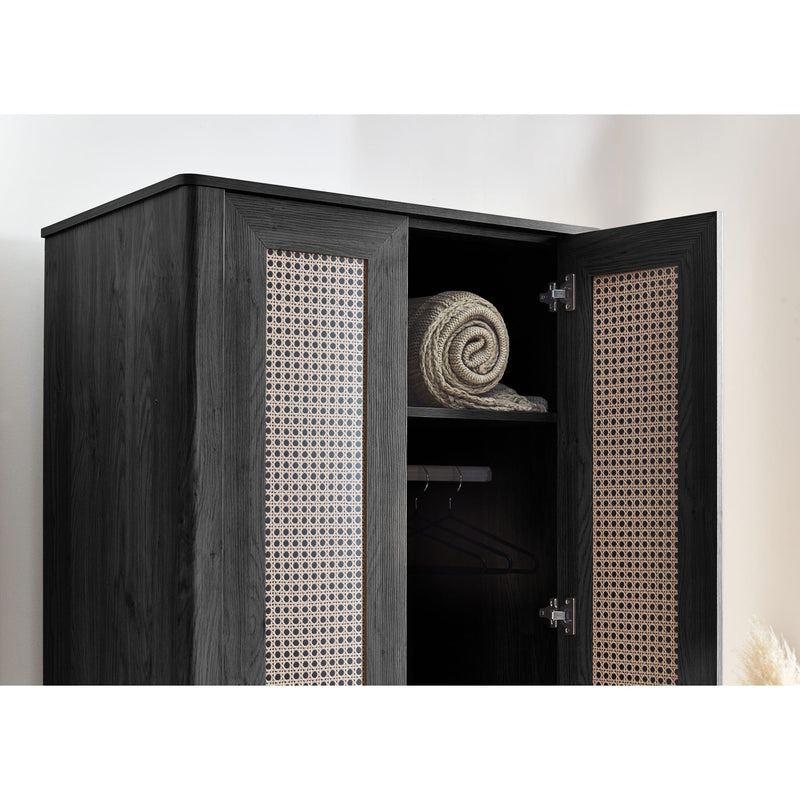 Black wardrobe with open door revealing a rolled-up towel inside, on a white background