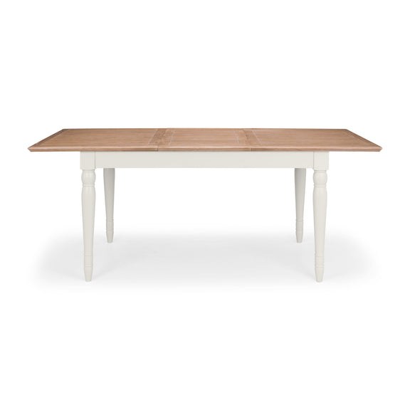Wooden table with white legs on a white background