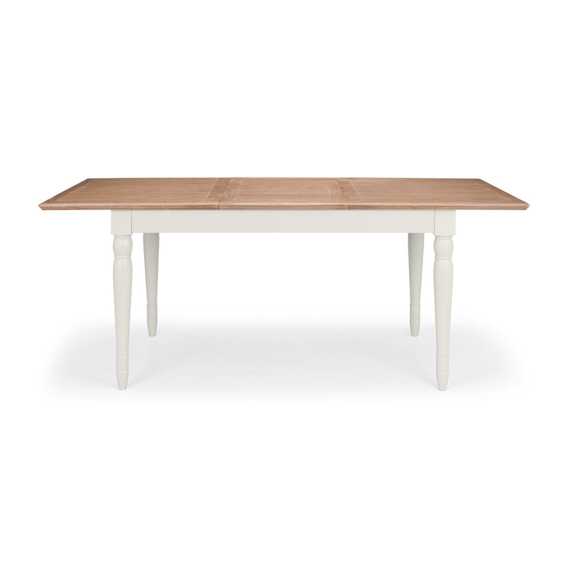 Wooden table with white legs on a white background