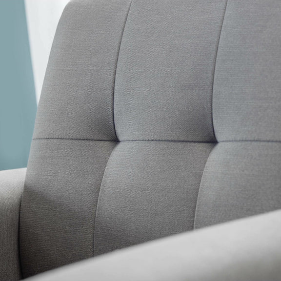 Close-up of a gray upholstered headboard