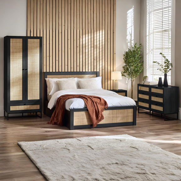 Modern bedroom with wooden furniture, bed, and decor elements.