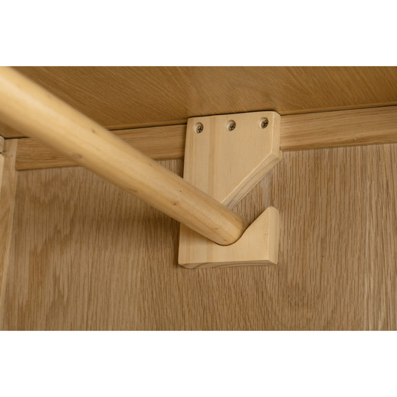 Wooden chair leg with bracket on a wooden surface