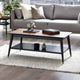 Modern living room with a gray sofa, wooden coffee table, and decorative items.