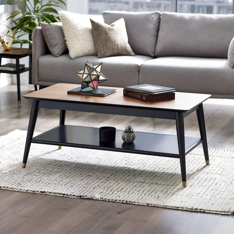 Modern living room with a gray sofa, wooden coffee table, and decorative items.