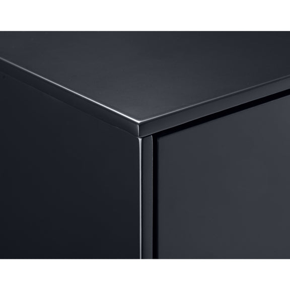 Close-up of a black metallic surface with a reflective finish