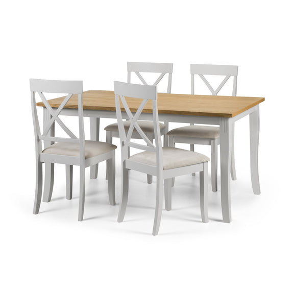 Dining table set with four chairs on a white background